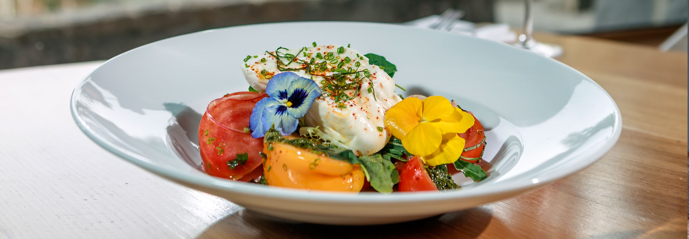 aura restaurant burrata cheese heirloom tomatoes